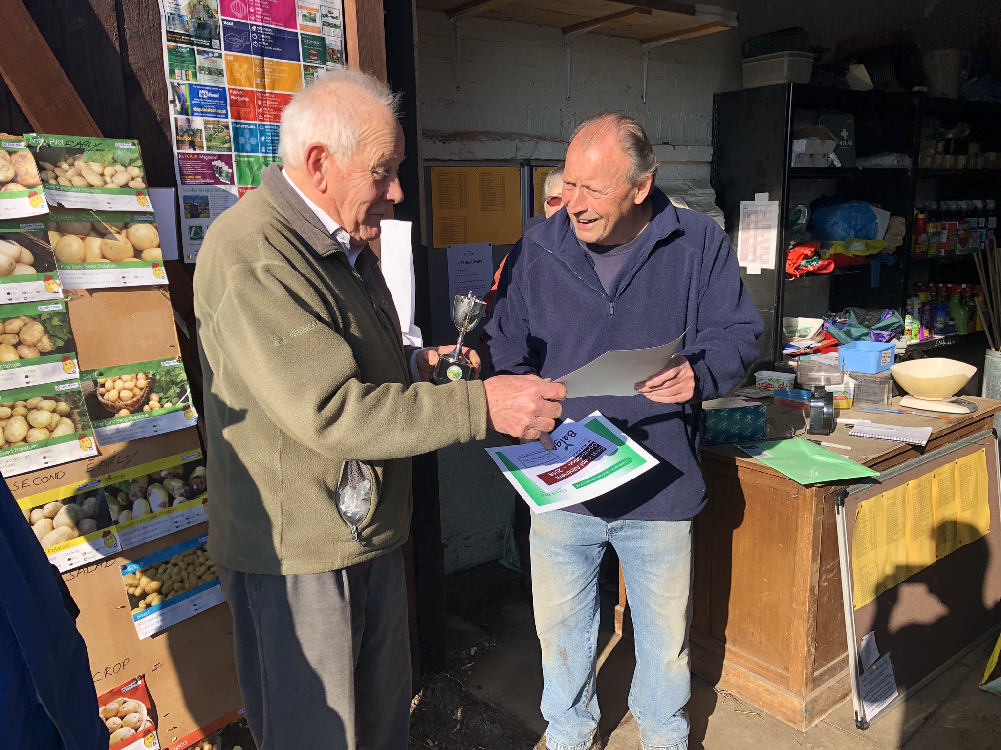 The 2018 Best Kept Allotment winner receiving his prize from Chairman, Mick Camp (left)